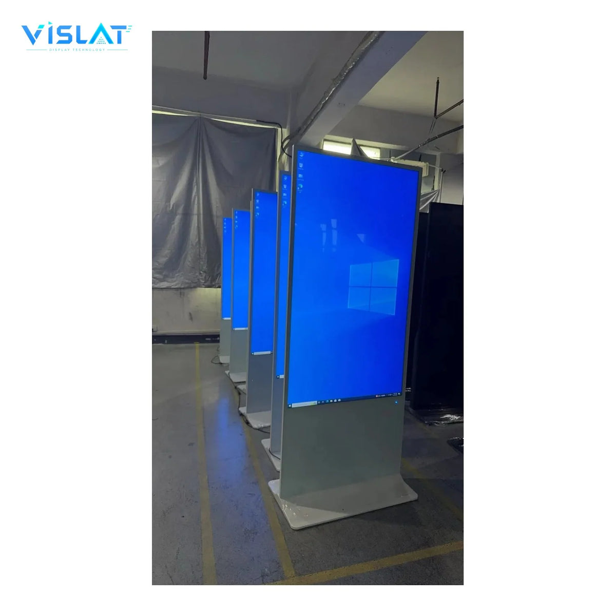 VISLAT 32 inch battery powered portable digital signage floor stand kiosks lined up in the workshop
